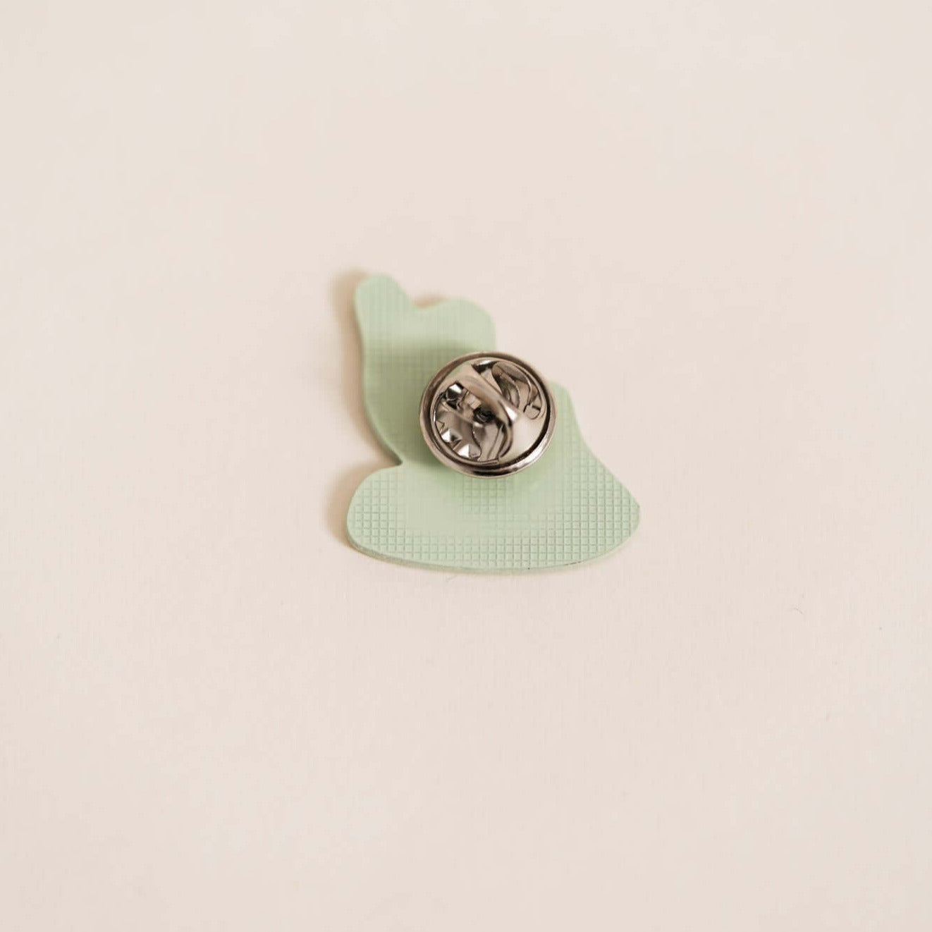 Back of Stylish high-quality metal pin. Embossed with high-gloss epoxy resin coating.
