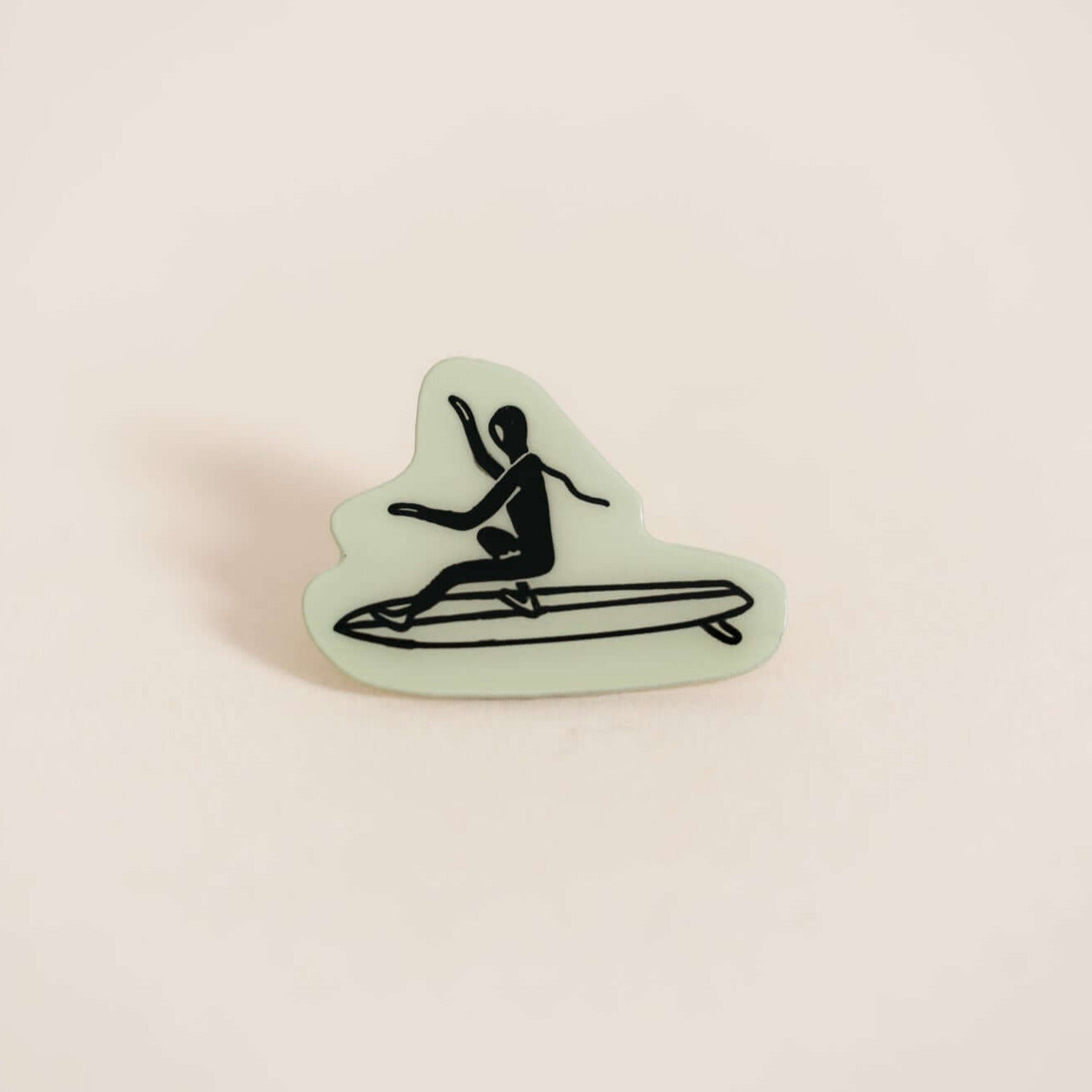 Stylish high-quality metal pin displaying surfer. Embossed with high-gloss epoxy resin coating.