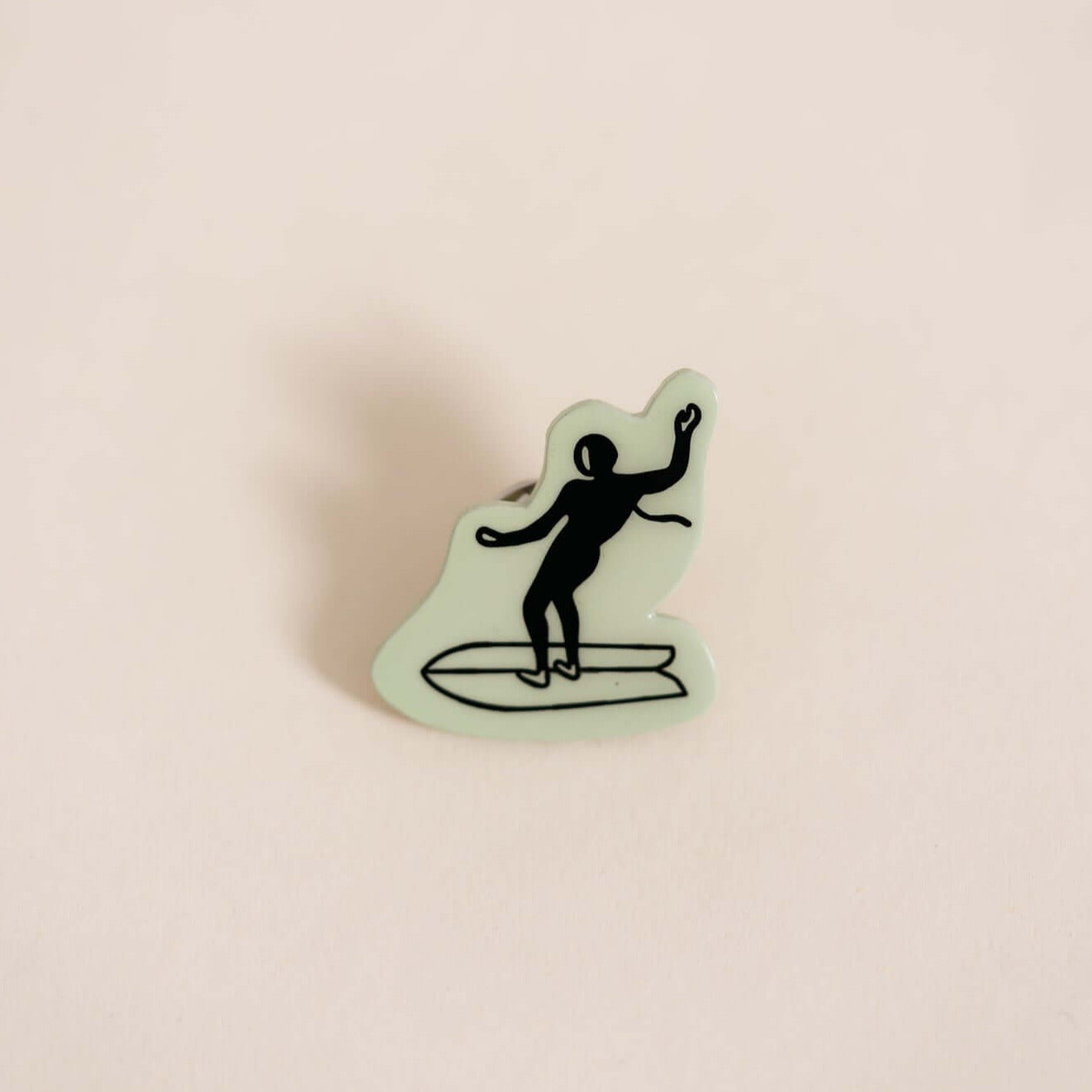 Stylish high-quality metal pin displaying surfer. Embossed with high-gloss epoxy resin coating.